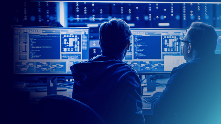 Two experts using managed services software to provide technical support for clients