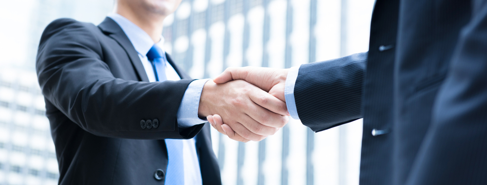 Two businesspeople shake hands