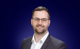 Vlad Morosanu, Head of Legal and Compliance, a professional man in glasses, smiling