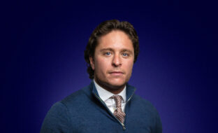 Harry Wilkinson, Summit Key Accounts, a dark-haired professional looking towards the camera