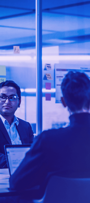 Phi experts discuss cloud solutions in a meeting